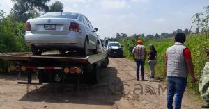 Localizan cadáver junto a vehículo en Coronango